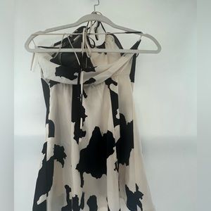 Urban outfitters Cow print mini dress! Adjustable at the neck and at the waist.